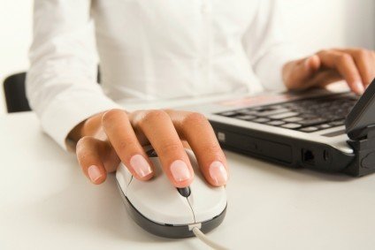 Female hand with mouse and keyboard